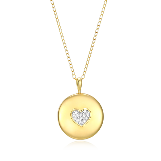 A round gold locket with a heart at the center composed of small diamonds on a white background